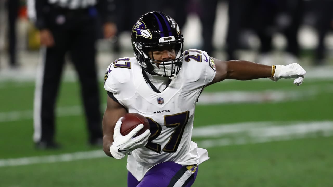 Baltimore Ravens running back J.K. Dobbins muscles through ...