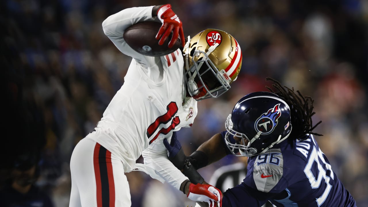 49ers wide receiver Brandon Aiyuk hurdles for touchdown, shows