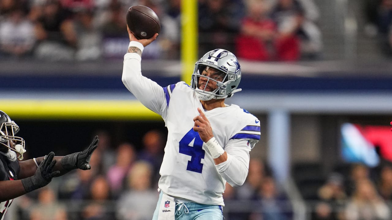 Dallas Cowboys' Dak Prescott (4) wears a cap styled with the Salute To  Service campaign logo as he warms up before an NFL football game against  the Kansas City Chiefs on Sunday