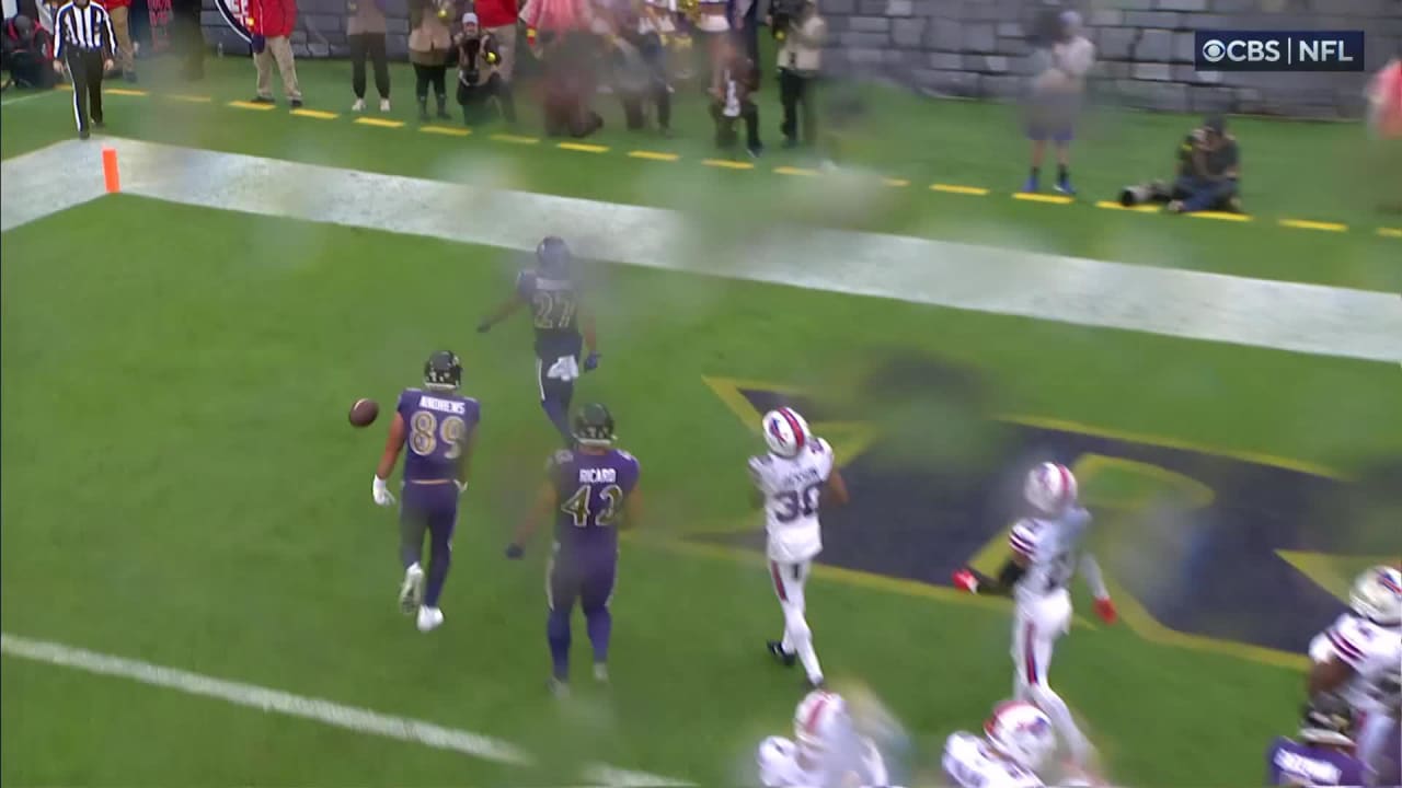 Baltimore Ravens running back J.K. Dobbins follows lane of blockers on