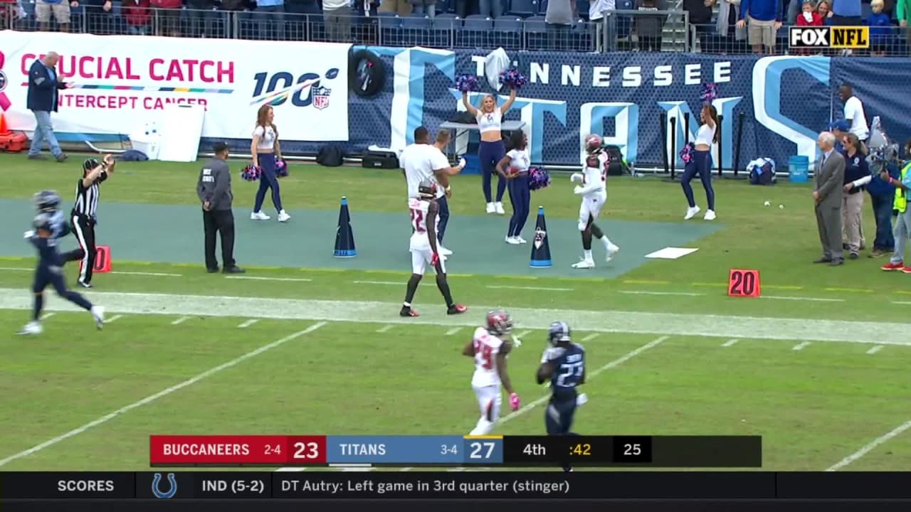 Titans Cheerleader Catches Punt with Poms, Cheerleader catching punts with pom  poms! 