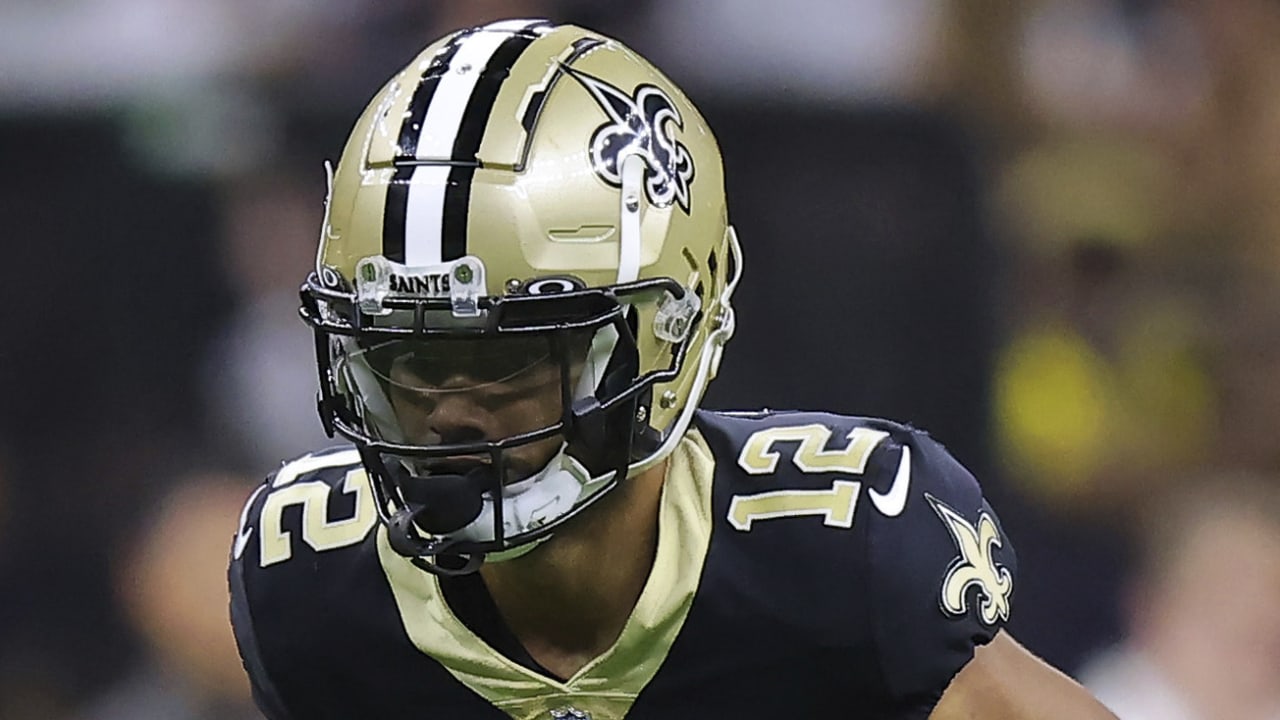 New Orleans Saints wide receiver Chris Olave wears his helmet showing an  American flag, Cuban flag and the Crucial Catch logo before an NFL football  game between the Saints and the Seattle