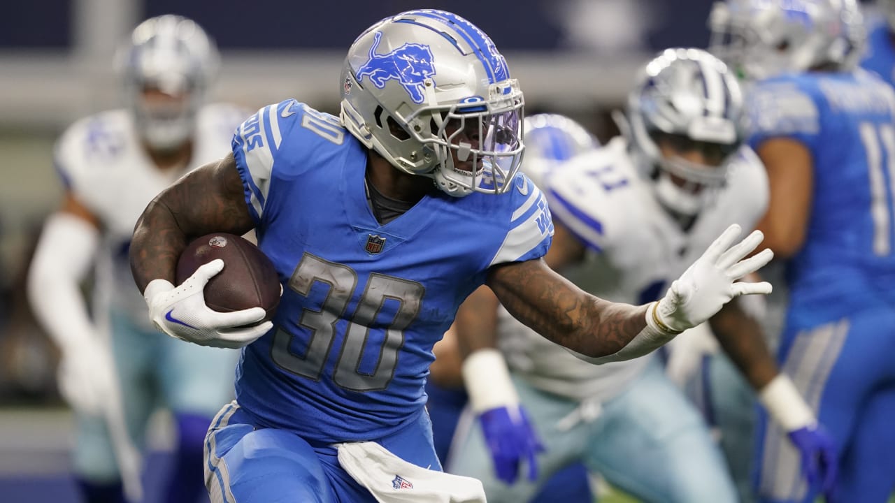 Detroit Lions running back Jamaal Williams runs with teh ball during an NFL  football game against the Seattle Seahawks, Sunday, Jan. 2, 2022, in  Seattle. The Seahawks won 51-29. (AP Photo/Stephen Brashear