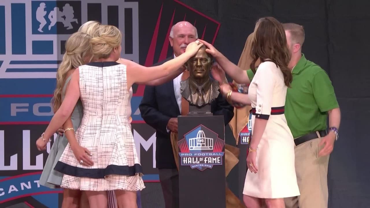 Photo: The Bowlen family with the bust of Pat Bowlen at the Pro