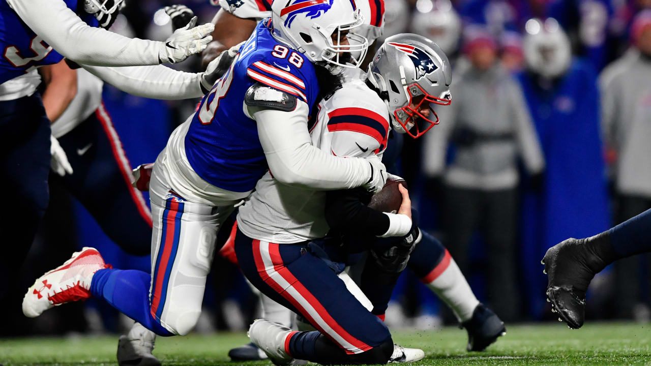 New England Patriots quarterback Mac Jones (10) is sacked by Buffalo Bills  defensive tackle Sta …