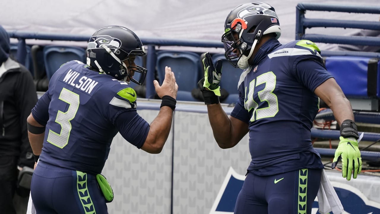 Seattle Seahawks' Carlos Dunlap on Russell Wilson: 'He told me he's with us  and he's here to stay' 