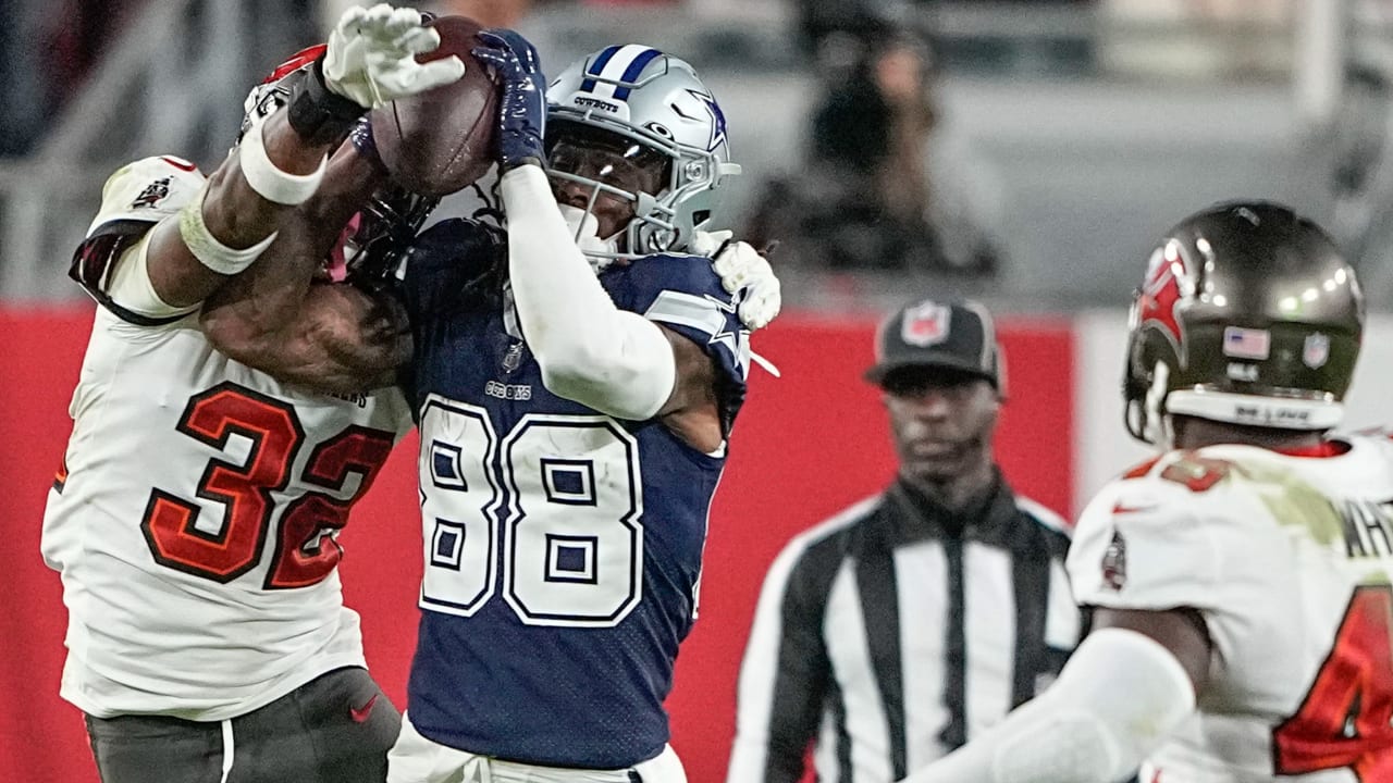 Dallas Cowboys quarterback Dak Prescott puts it on a rope for wide receiver  CeeDee Lamb