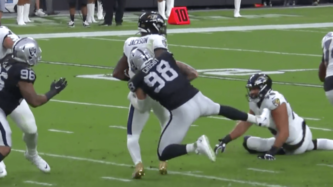 Raiders defensive end Maxx Crosby (98) sacks Baltimore Ravens