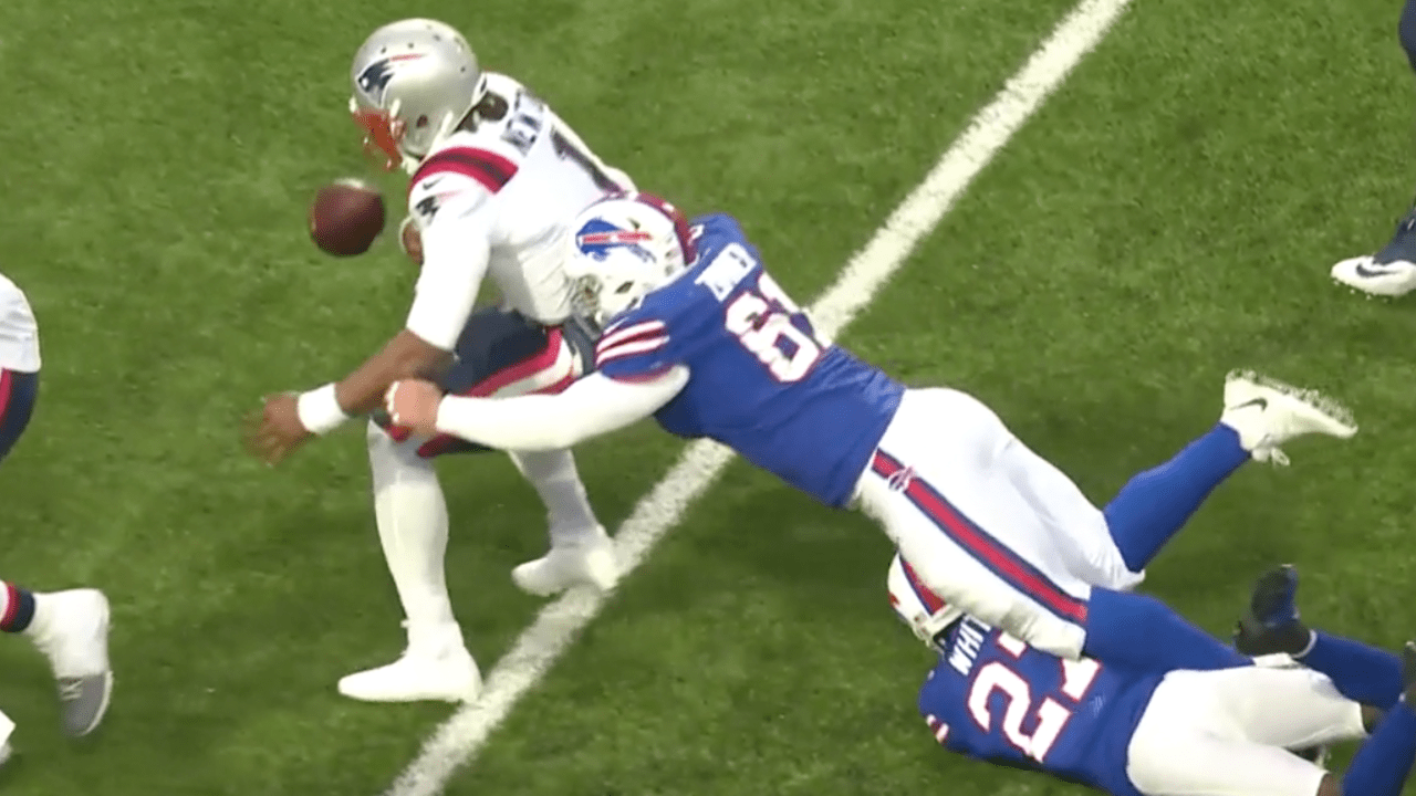 Buffalo Bills defensive tackle Justin Zimmer punches ball from New England  Patriots quarterback Cam Newton for game-winning Bills turnover