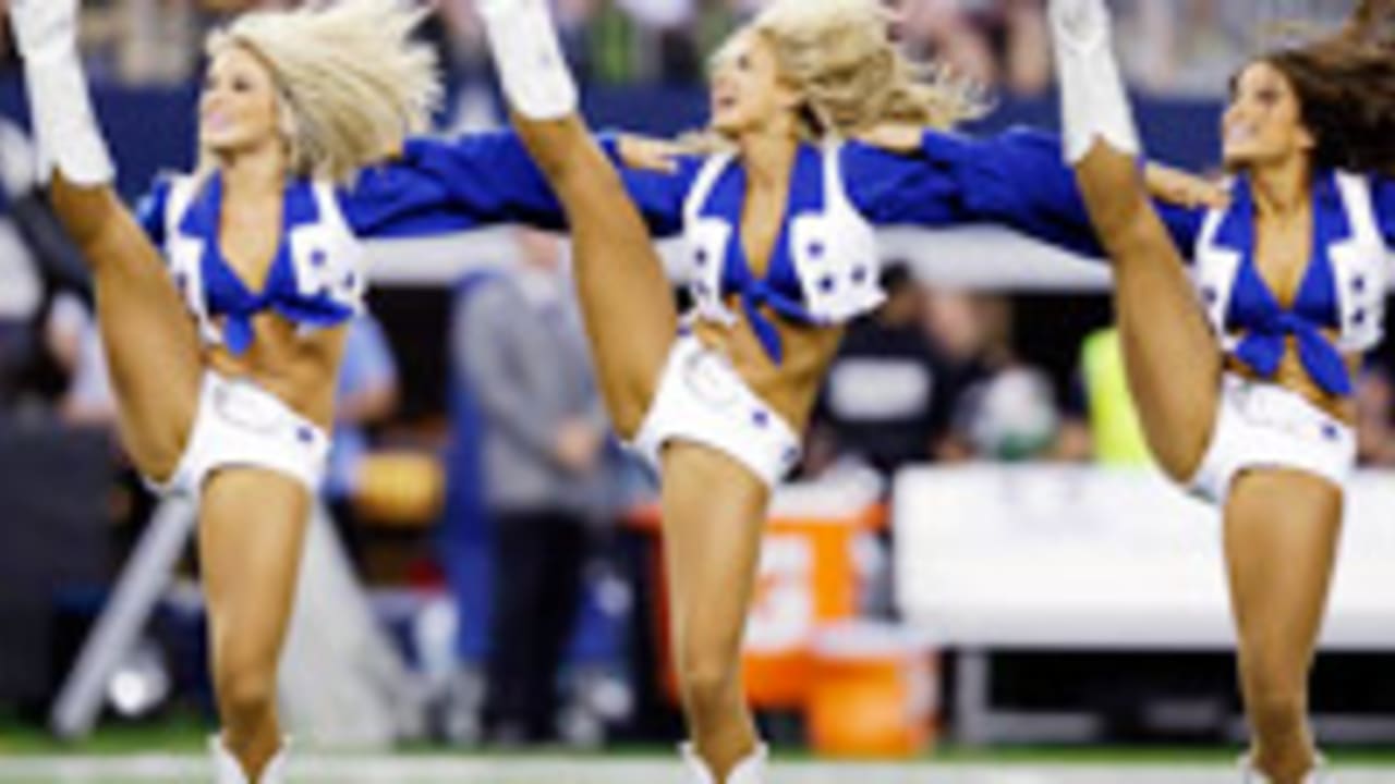 A member of the Washington Commanders cheerleaders performing on the field  during the second half of an NFL preseason football game against the  Cincinnati Bengals, Saturday, Aug. 26, 2023, in Landover, Md. (