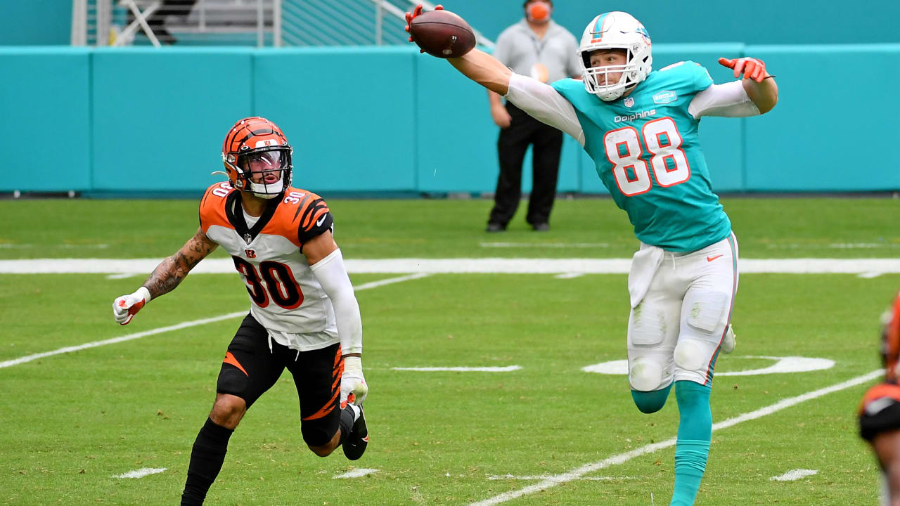 Miami Dolphins tight end Mike Gesicki (88) runs on the field