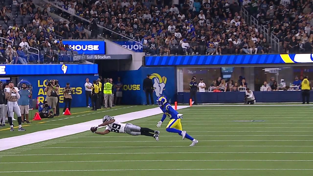 Las Vegas Raiders wide receiver Tre Tucker dives to secure a football ...