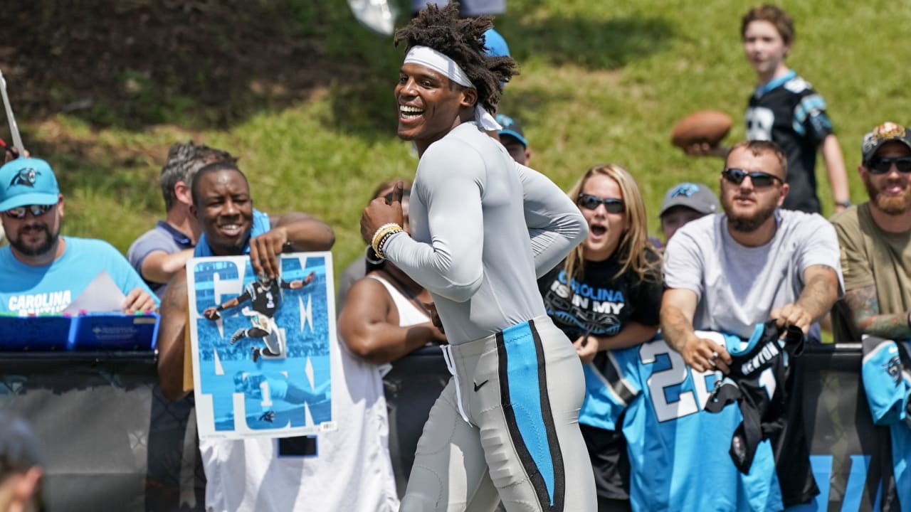 Welcoming back Carolina Panthers quarterback Cam Newton a Panthers fan  holds up a sign prior to an NFL football game against the Arizona Cardinals  Sunday, Nov. 14, 2021, in Glendale, Ariz. The