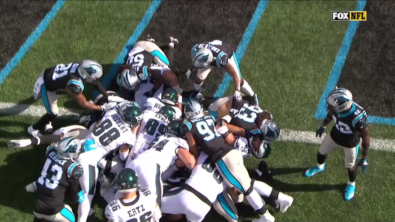 Philadelphia Eagles quarterback Jalen Hurts plunges through blockers