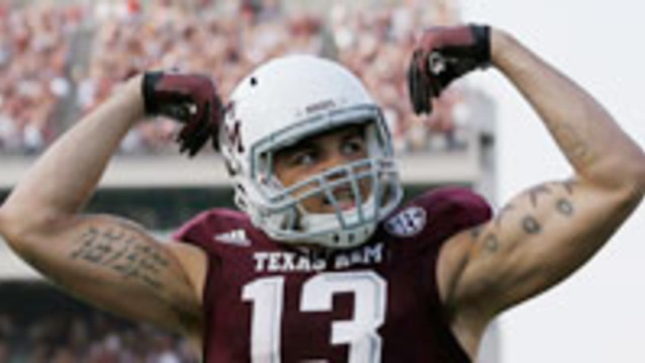 Mike Evans Texas A&M Aggies Unsigned White Jersey Running and Breaking  Tackle with Ball vs. Oklahoma Sooners Photograph