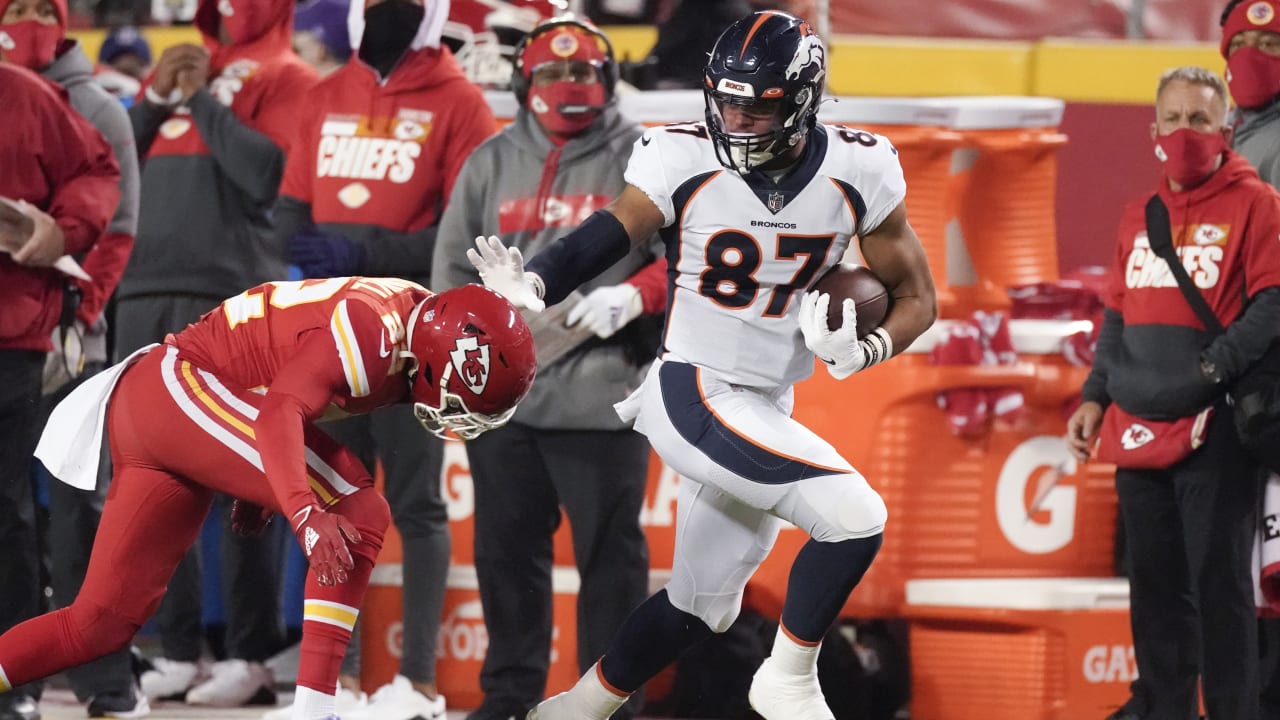 Denver Broncos tight end Noah Fant flies past Breeland for