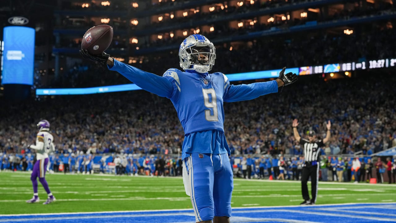 Detroit Lions' Jameson Williams catches a touchdown pass during