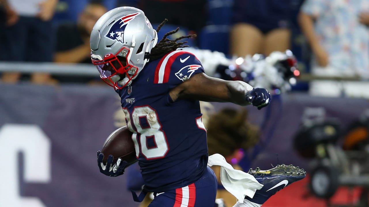 New England Patriots running back Rhamondre Stevenson throws Atlanta  Falcons defensive back to ground with furious stiff arm