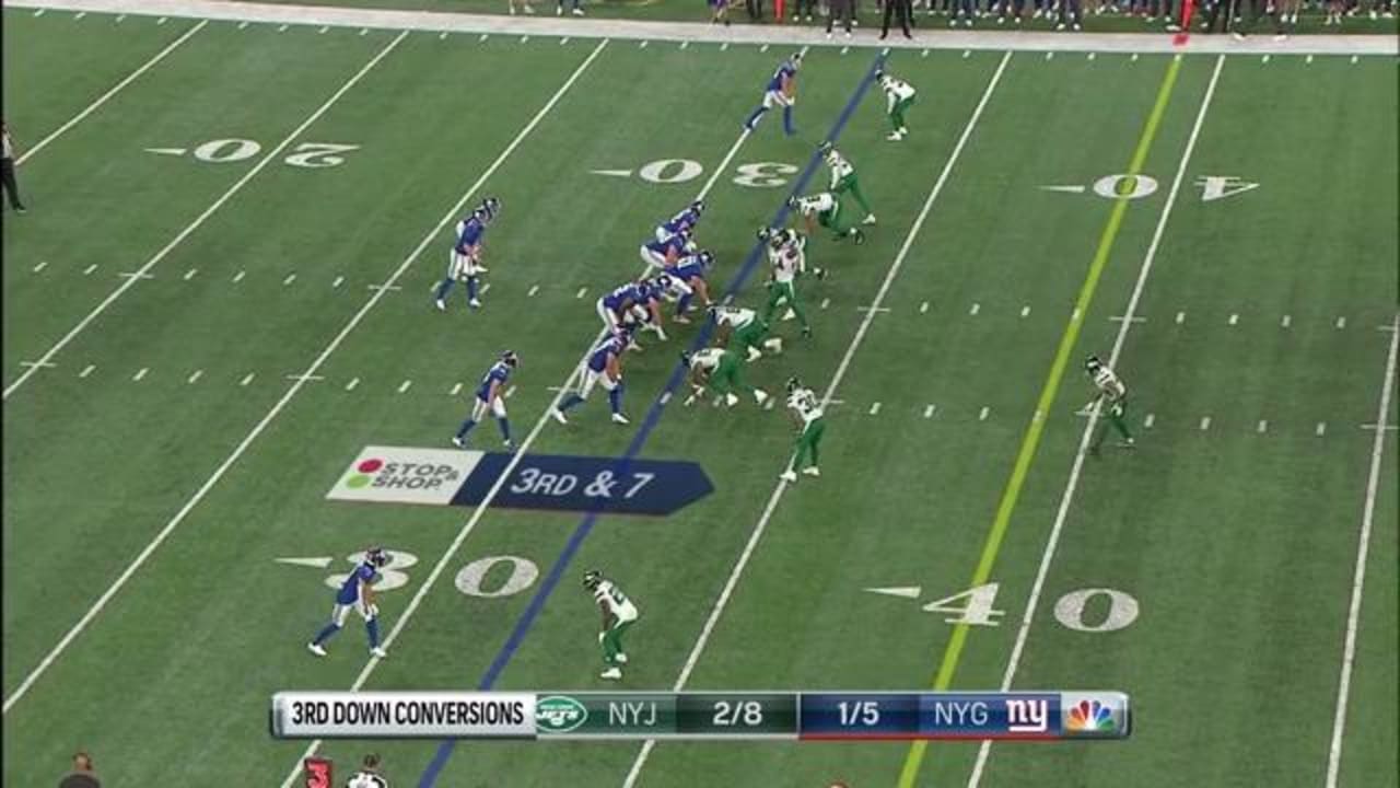 New York Jets defensive end Hamilcar Rashed Jr. drops New York Giants  quarterback Clayton Thorson for third-down sack