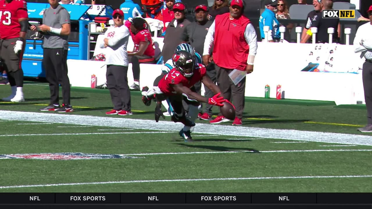 Bucs wide receiver Chris Godwin giving jersey number to Tom Brady