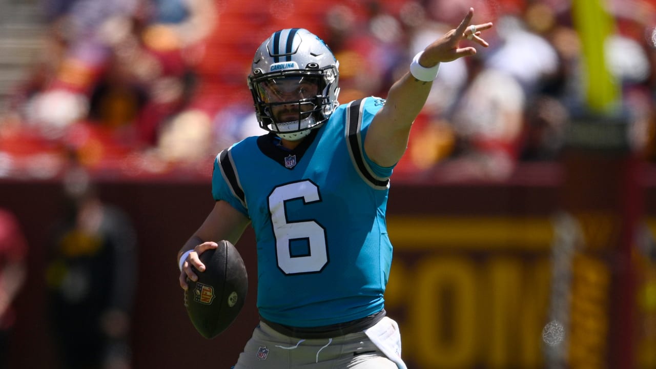 Carolina Panthers quarterback Baker Mayfield scrambles out of