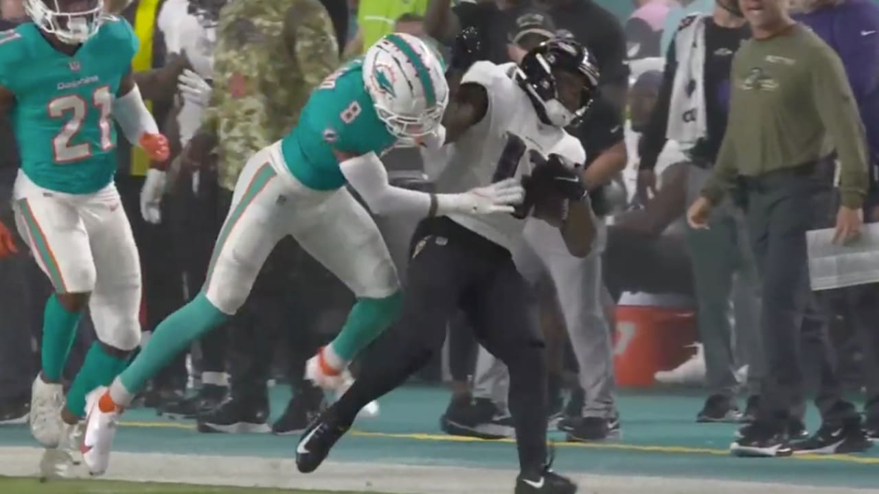 Miami Dolphins safety Jevon Holland ends wide receiver Devin