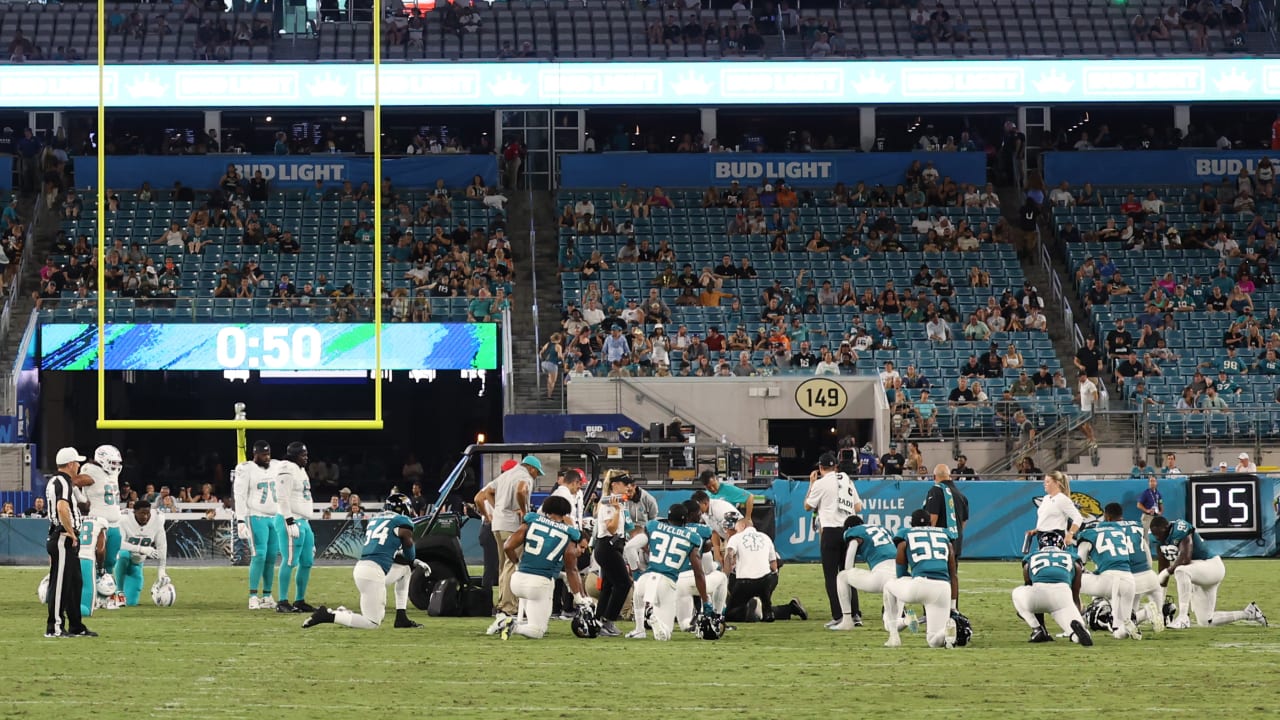 Daewood Davis of Dolphins carted off field after collision