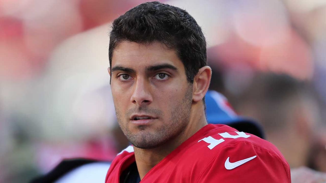 San Francisco 49ers quarterback Jimmy Garoppolo, right, greets players  during warm-ups before an NFL football game against the New York Giants,  Sunday, Sept. 27, 2020, in East Rutherford, N.J. (AP Photo/Bill Kostroun