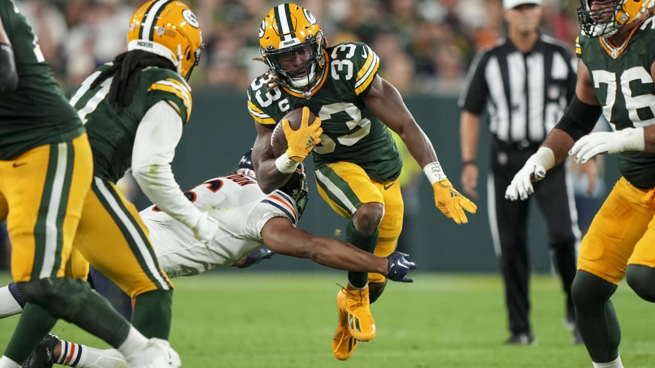 Green Bay Packers' Aaron Jones celebrates his touchdown run during the  first half of an NFL football game against the Chicago Bears Sunday, Sept.  18, 2022, in Green Bay, Wis. (AP Photo/Morry