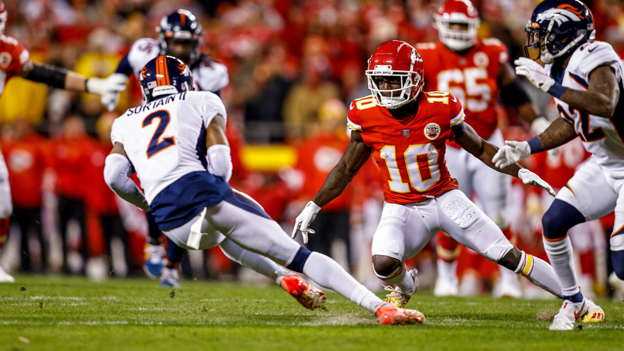 Denver Broncos cornerback Pat Surtain II swipes a deflected