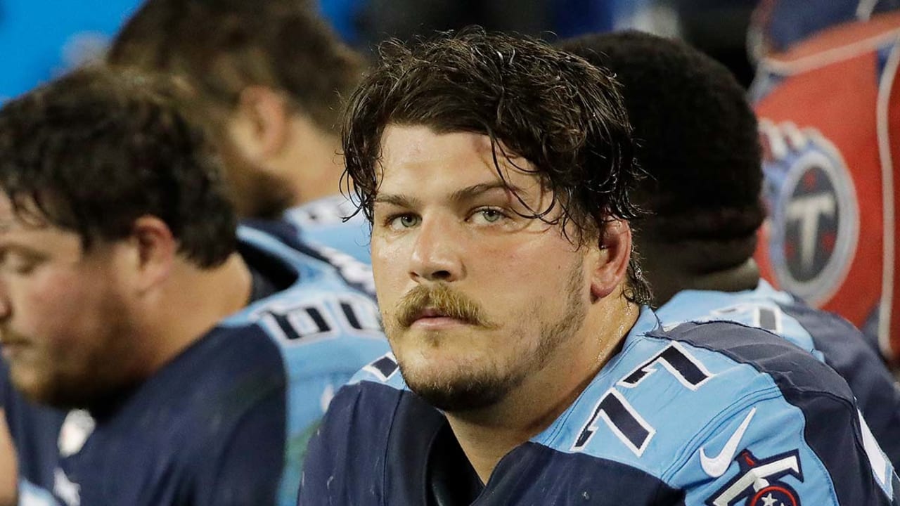 Taylor Lewan of the Tennessee Titans watches a replay during a