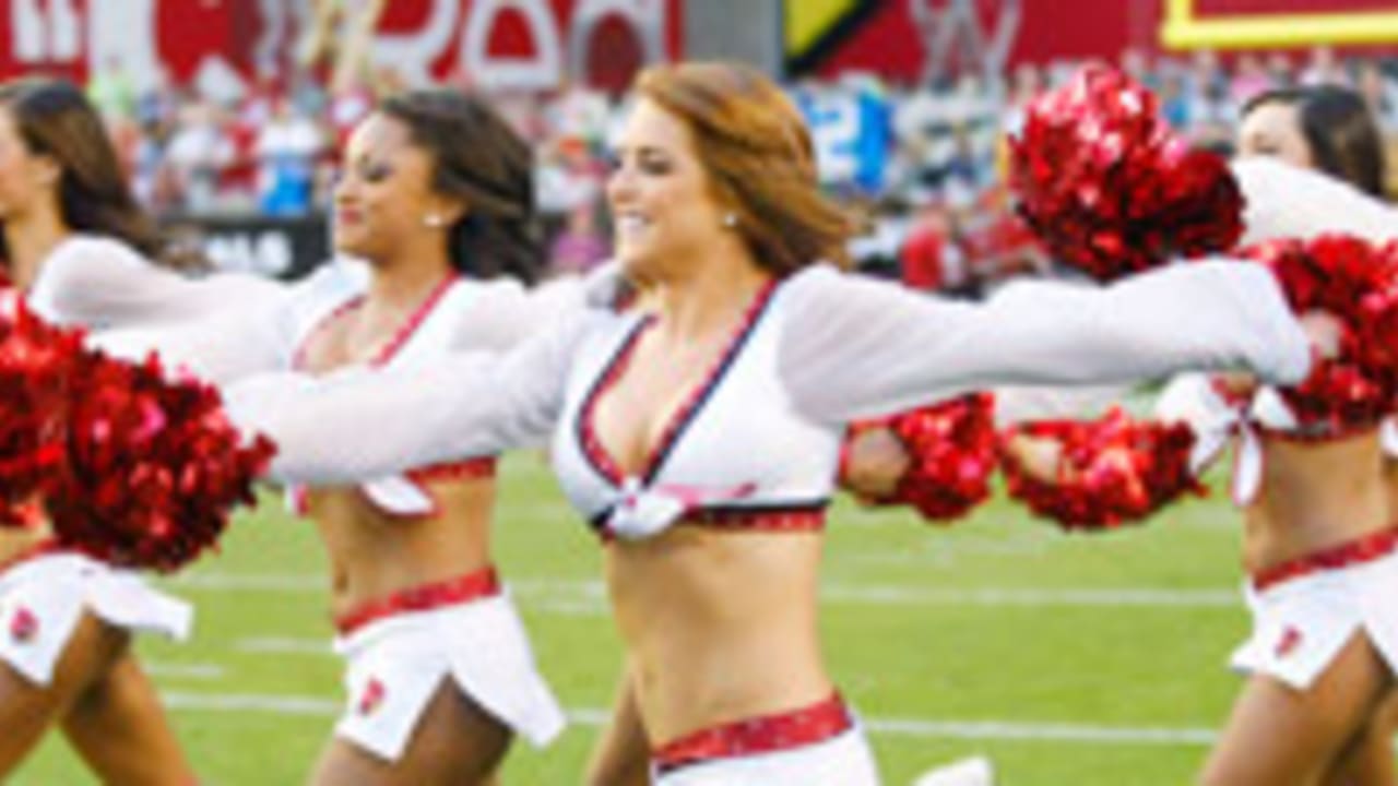 An Arizona Cardinals cheerleader performs in a Halloween costume