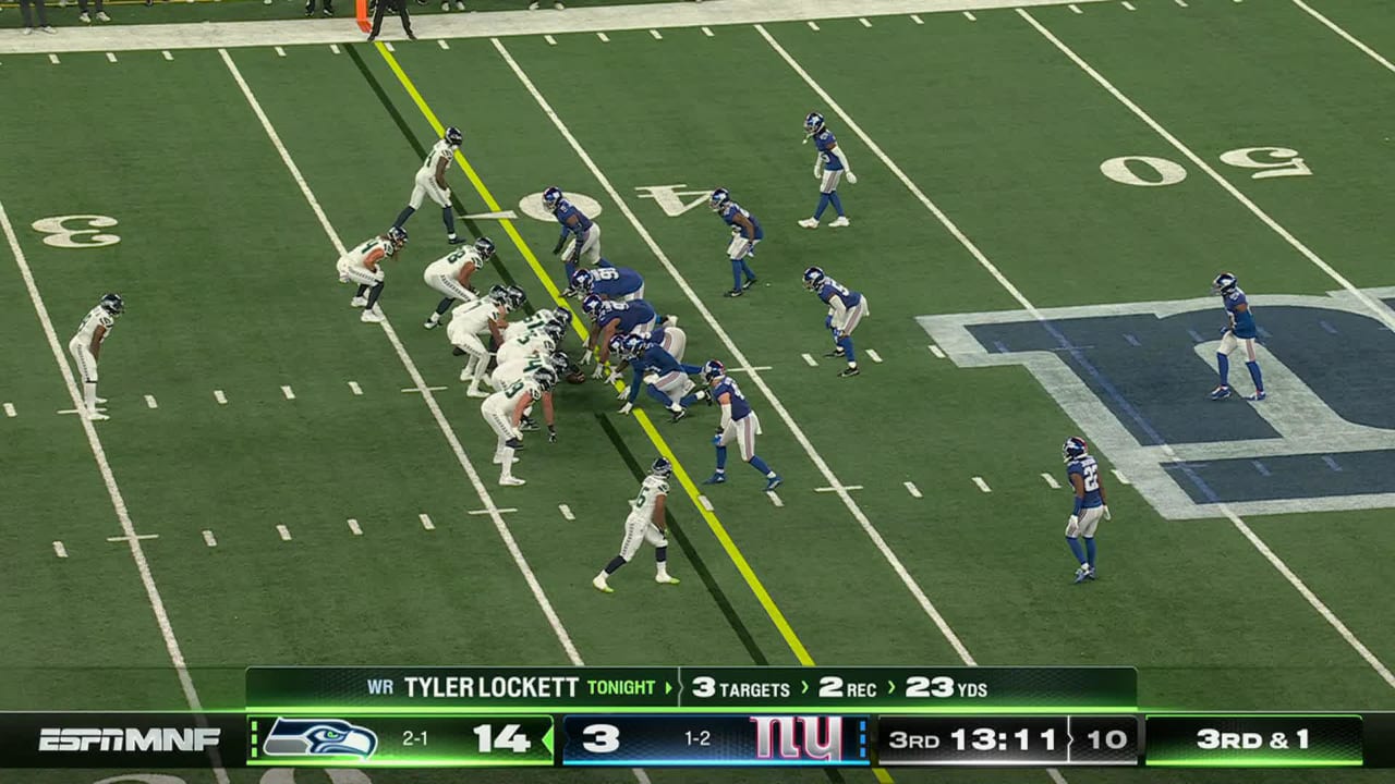 Seattle Seahawks quarterback Geno Smith lofts 23-yard pass to wide