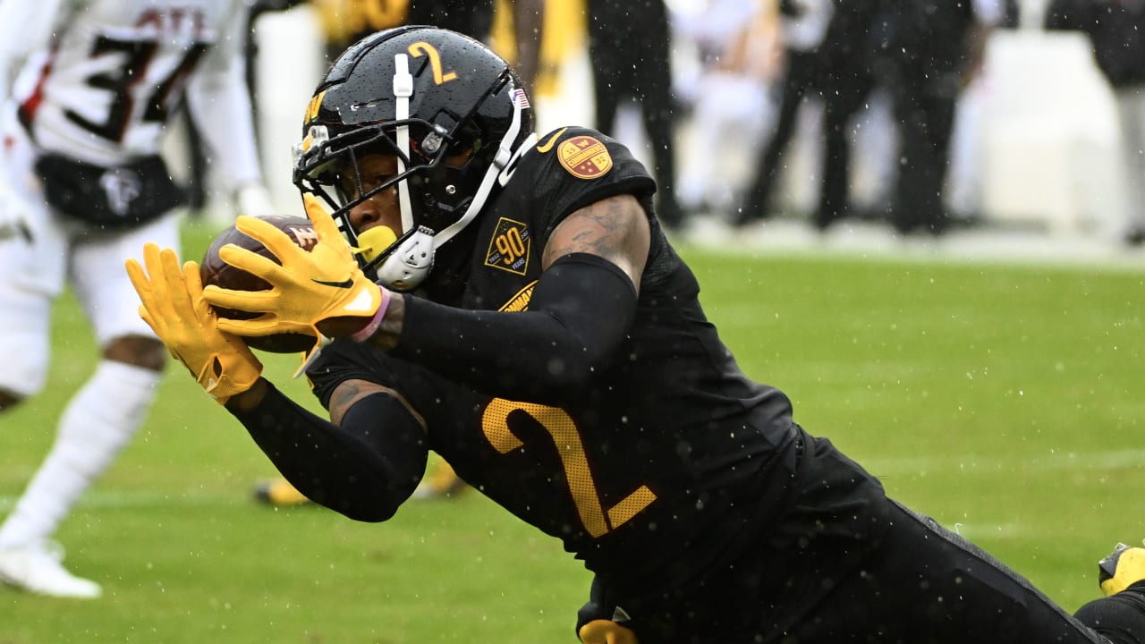 Washington Commanders wide receiver Dyami Brown (2) adjusting his helmet in  the rain before the start of an NFL football game against the Atlanta  Falcons, Sunday, Nov. 27, 2022, in Landover, Md. (