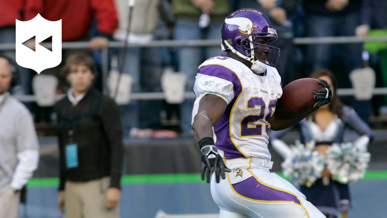 FILE- In this file photo taken Aug. 25, 2010, in Seattle, Minnesota Vikings  running back Chester Taylor runs pushing off Seattle Seahawks' Chuck Darby.  Taylor, who is now with the Chicago Bears