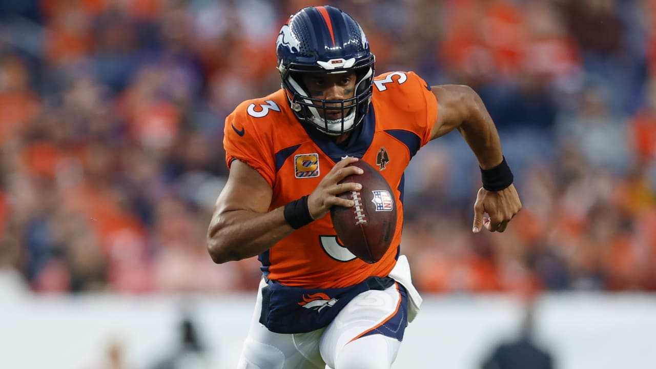 Denver Broncos quarterback Russell Wilson flashes his wheels on 18yard