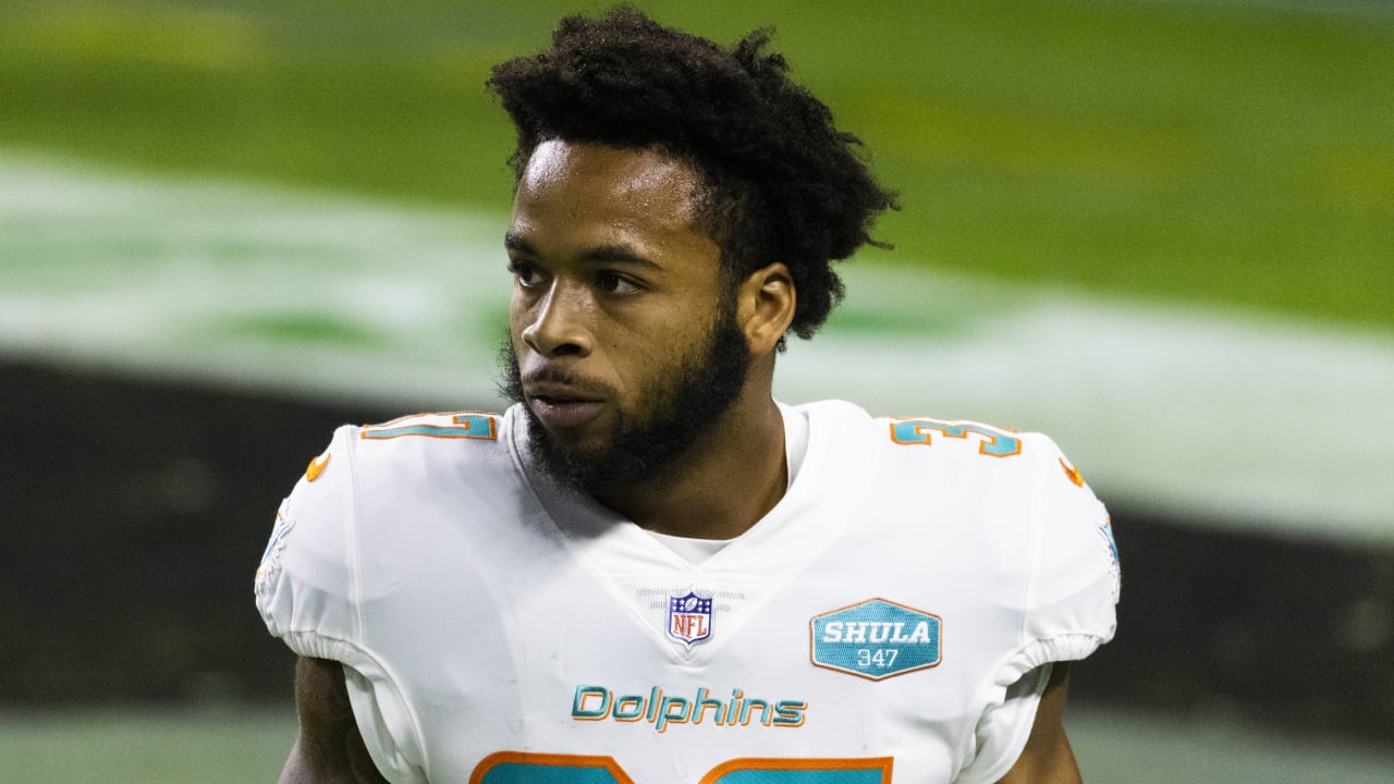 Miami Dolphins running back Salvon Ahmed (26) and running back Myles Gaskin  (37) watch from the sideline during the first half of a NFL preseason  football game Las Vegas Raiders, Saturday, Aug.