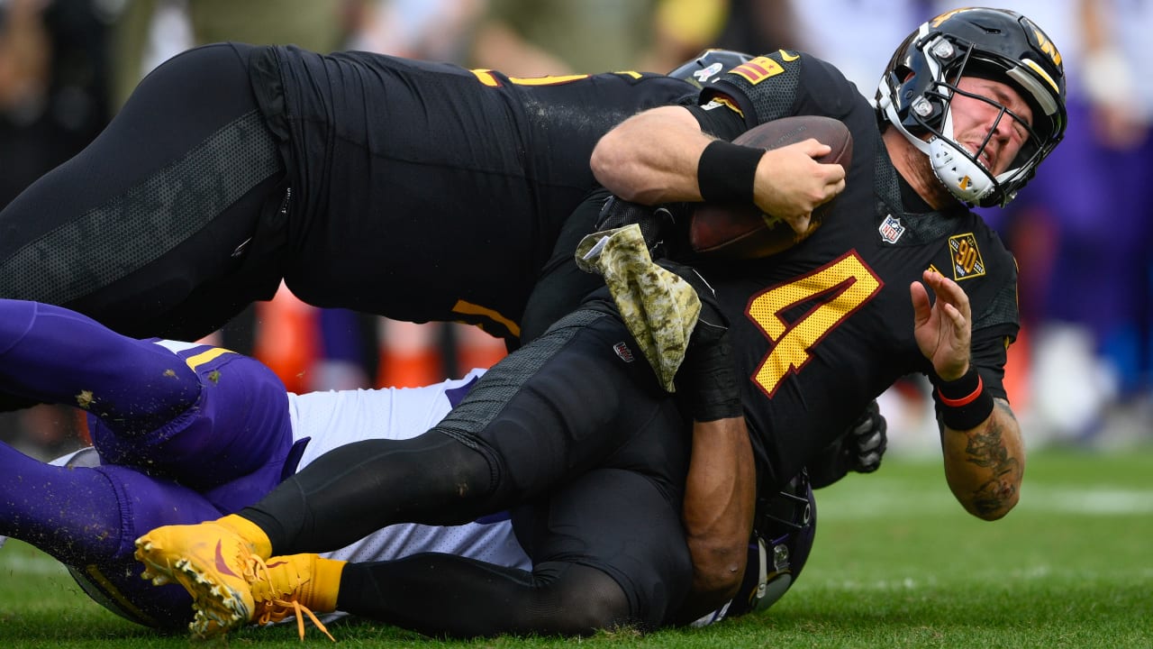 Minnesota Vikings linebacker D.J. Wonnum (98) reacting after sacking  Washington Commanders quarterback Taylor Heinicke during the