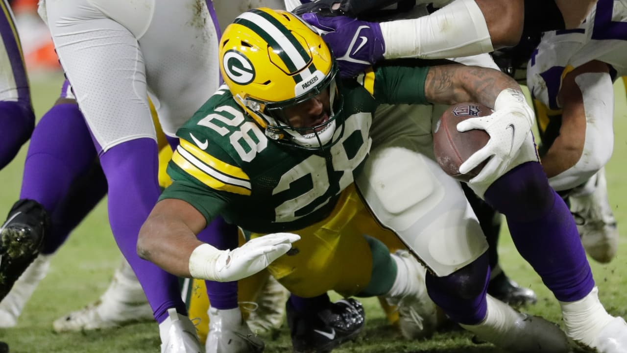 Miami. FL USA; Green Bay Packers running back AJ Dillon (28) is tripped up  while running with the ball short of the end zone during an NFL game again  Stock Photo - Alamy