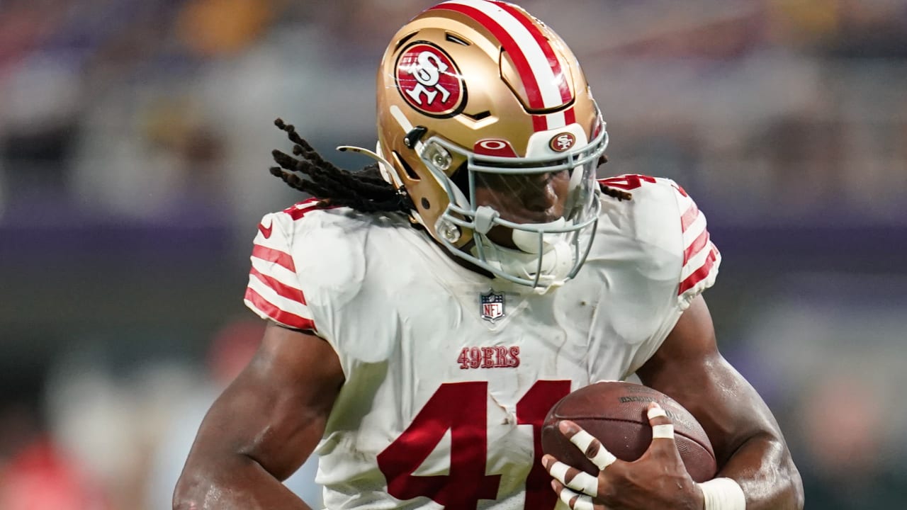 San Francisco 49ers running back Jordan Mason runs over, through 