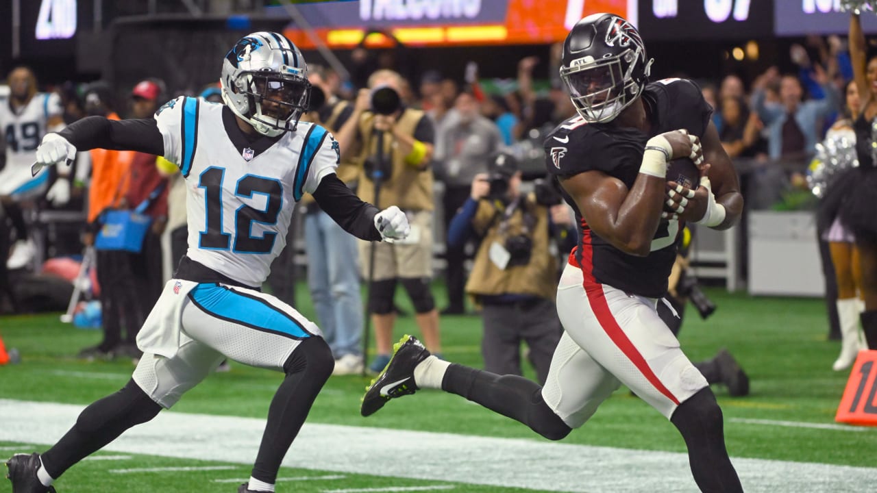 ATLANTA, GA - OCTOBER 30: Atlanta Falcons linebacker Lorenzo Carter (9)  carries the football for a pick six during the Sunday afternoon NFL game  between the Carolina Panthers and the Atlanta Falcons