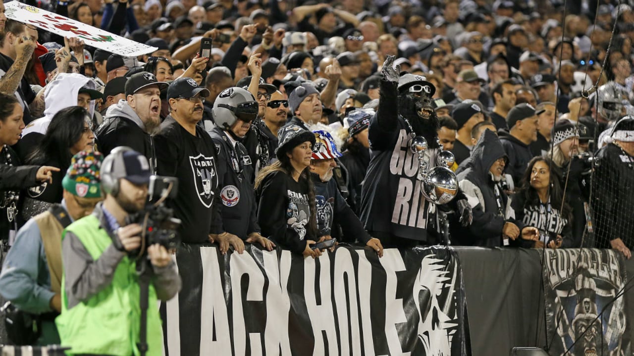 Las Vegas Raiders fans look on during the first half of an NFL