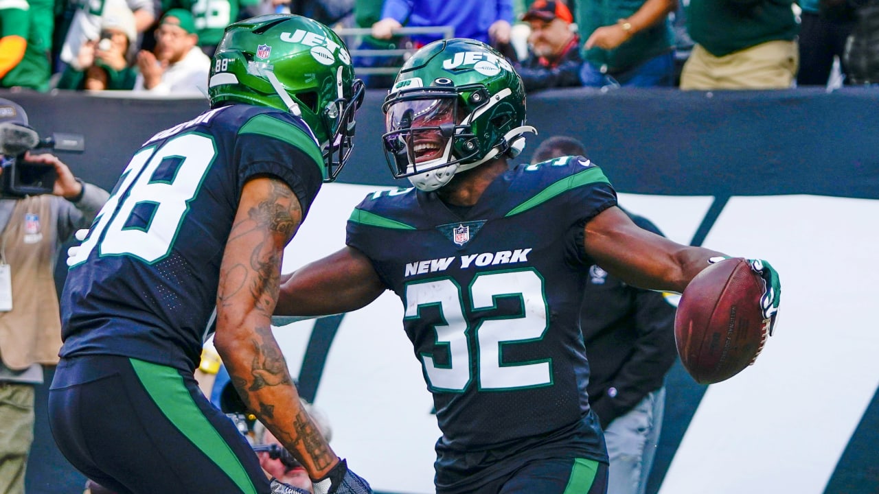 New York Jets running back Michael Carter (32) warms up before taking on  the Miami Dolphins during an NFL football game Sunday, Oct. 9, 2022, in  East Rutherford, N.J. (AP Photo/Adam Hunger