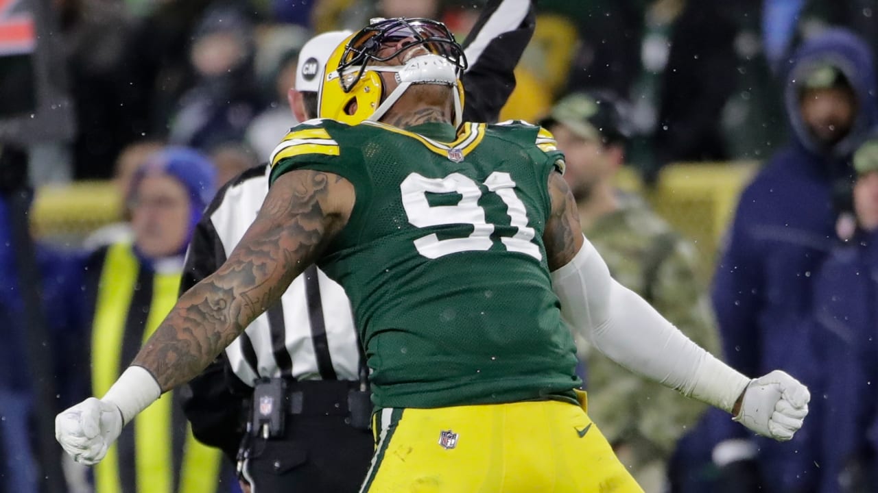 Green Bay, WI, USA. 12th Jan, 2020. Green Bay Packers outside linebacker Preston  Smith #91 after sacking Seattle Seahawks quarterback Russell Wilson #3 late  in the gameduring the NFL Football game between