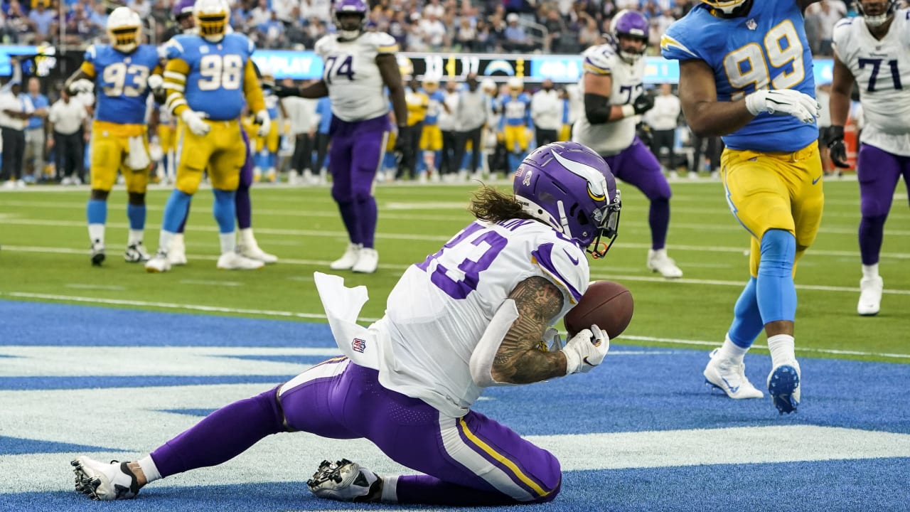 Tyler Conklin of the Minnesota Vikings runs for yards after a