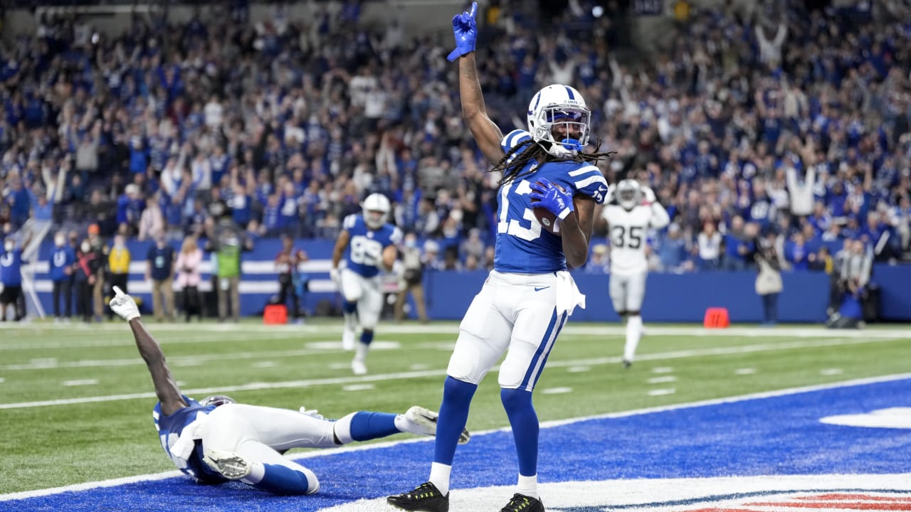 Indianapolis Colts wide receiver T.Y. Hilton (13) makes a touchdown catch  under pressure from R …