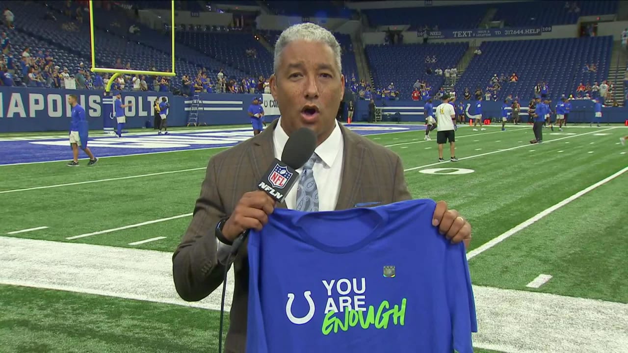 NFL Network's Steve Wyche shows Indianapolis Colts' 'Kicking the Stigma'  warm-up T-shirts before Week 2