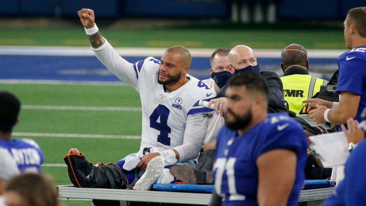 Dallas Cowboys quarterback Dak Prescott is carted off the field with an