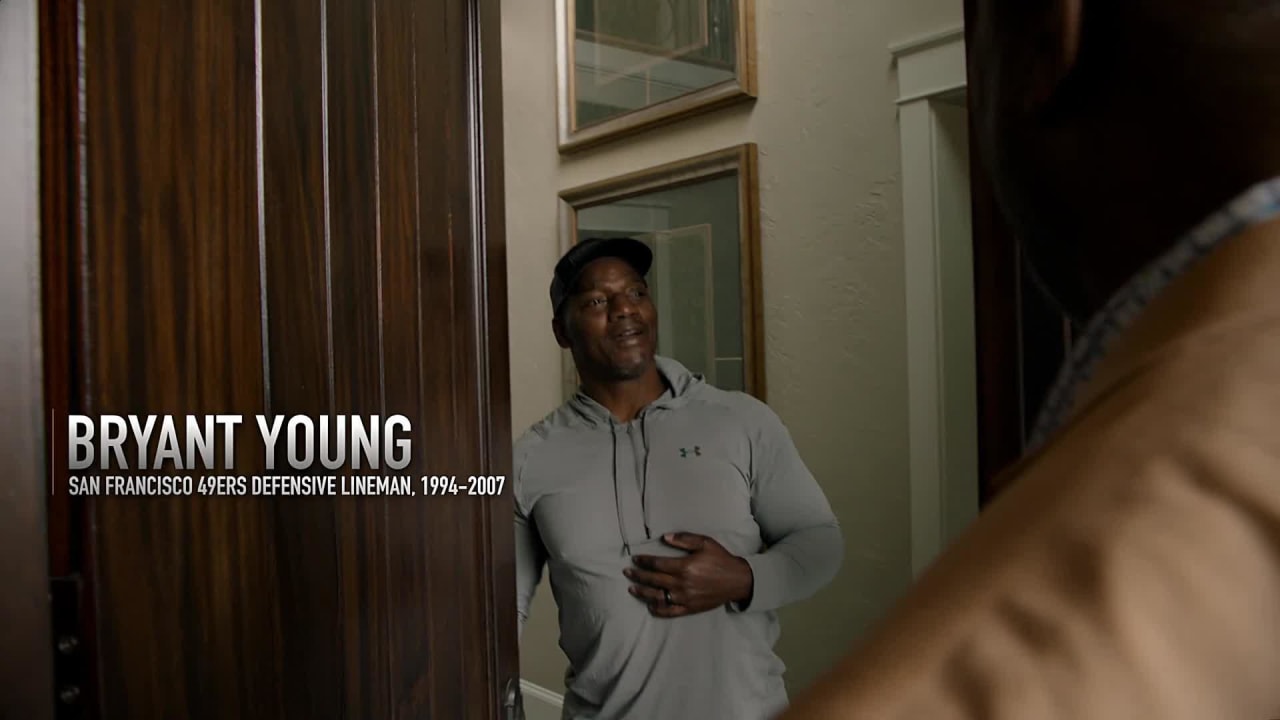 Former San Francisco 49ers teammate Charles Haley informs Bryant Young of  Hall of Fame induction