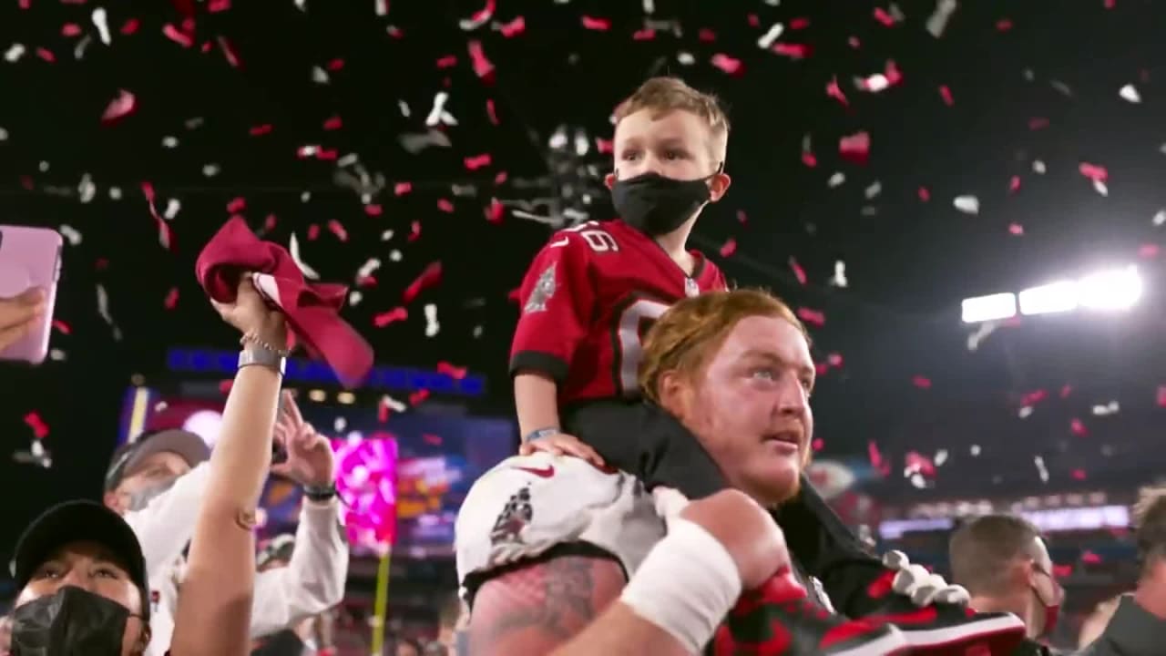 Feb 7, 2021; Tampa, FL, USA; Tampa Bay Buccaneers center Ryan Jensen (66)  celebrates with his son, Wyatt, after the Tampa Bay Buccaneers beat the  Kansas City Chiefs in Super Bowl LV